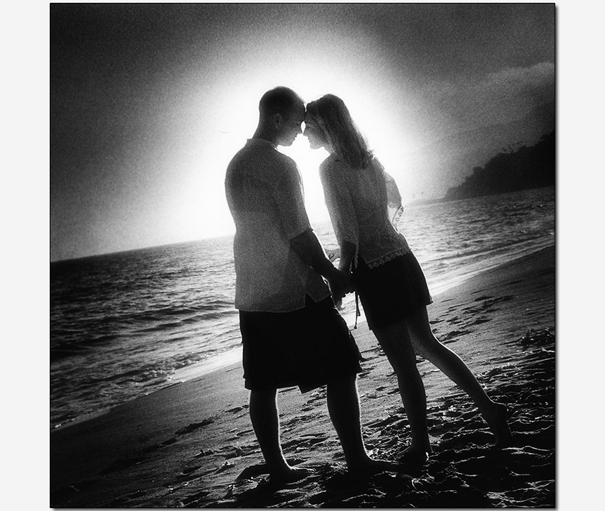 couple silhouetted by sunset engagement session photos
