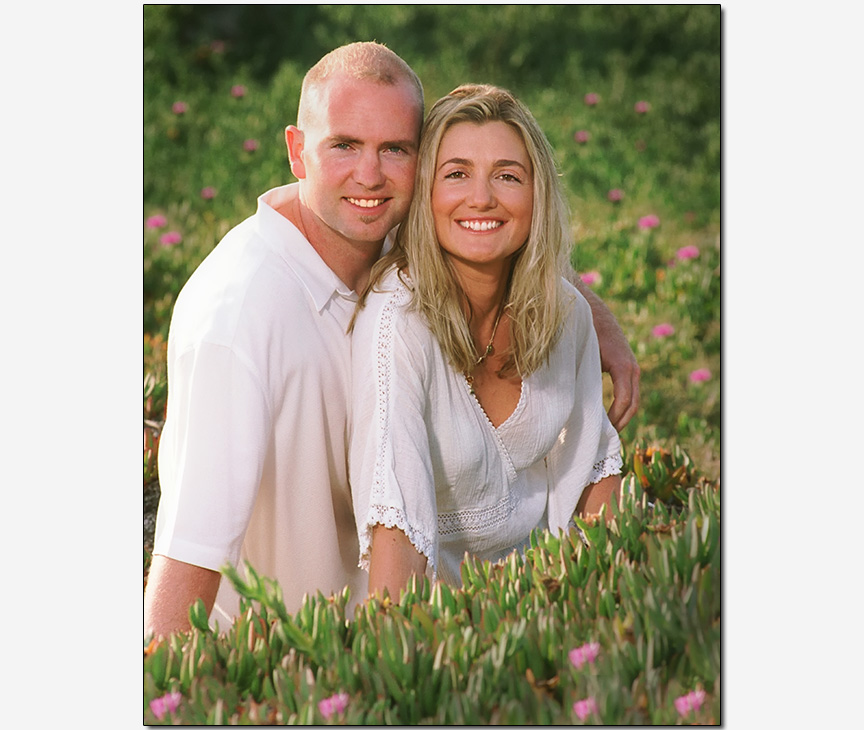 couple check-to-check smiles sitting in icicle plants