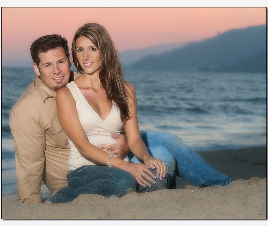 engagement session  with a couple on a beach at sunset